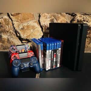 Sony PS4 Slim 1TB with 3 controllers and Game Collection